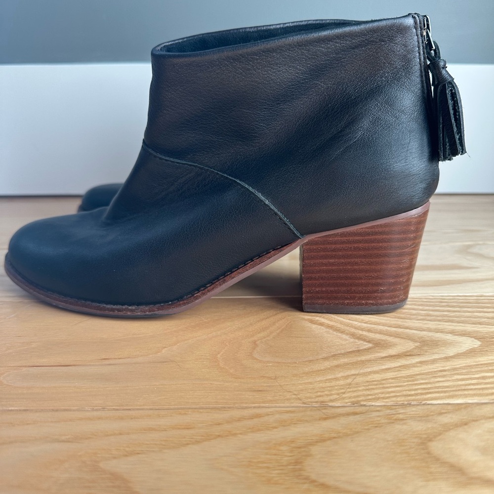 Tom’s black leather wood color heel bootie. Size 9